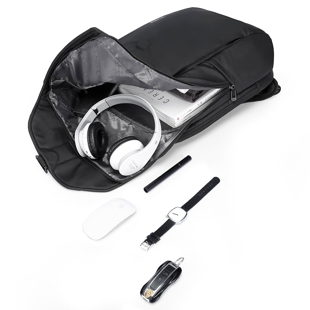 Open black backpack with books, white headphones, and tech items like a mouse, pen, watch, and keys.