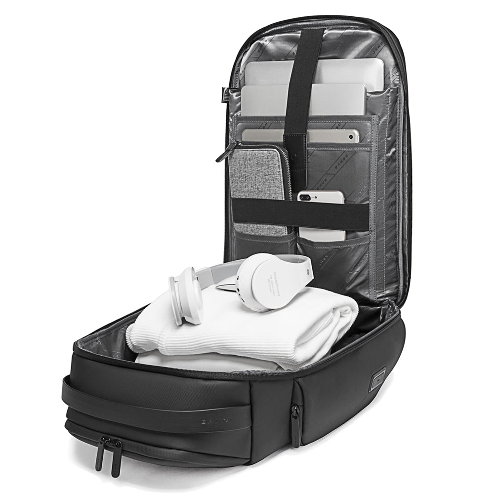 Bange 7277 Model Open black backpack with compartments holding a laptop, tablet, and smartphone.