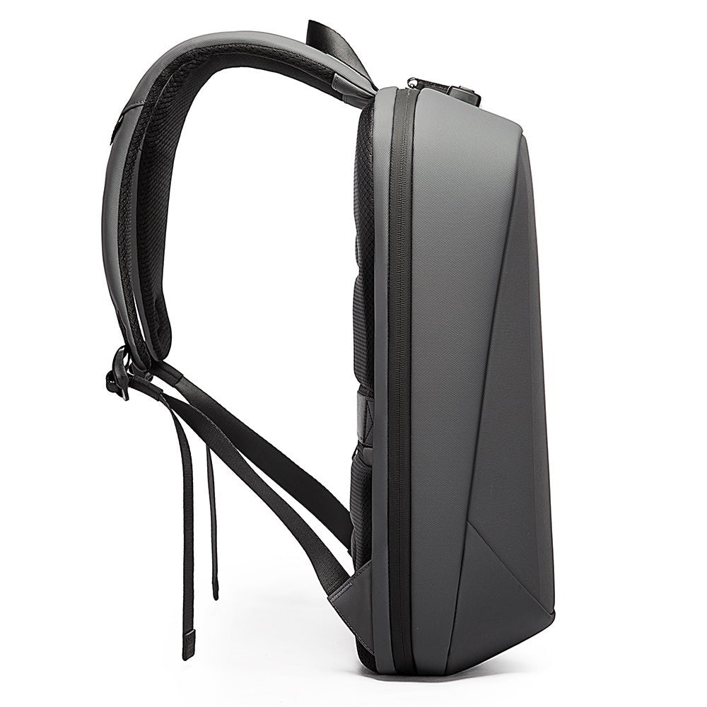 Slim grey anti-theft backpack side view with padded straps and sleek geometric shell design.